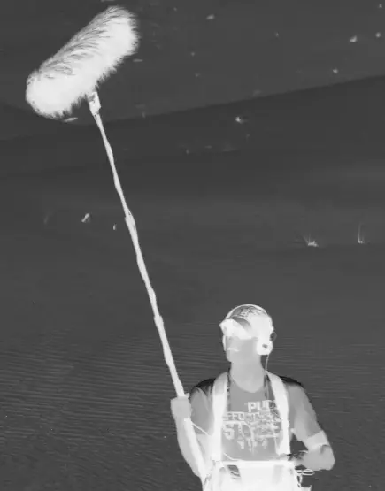 Sound engineer with boom microphone on set – ENG Team Videoproduktion München.