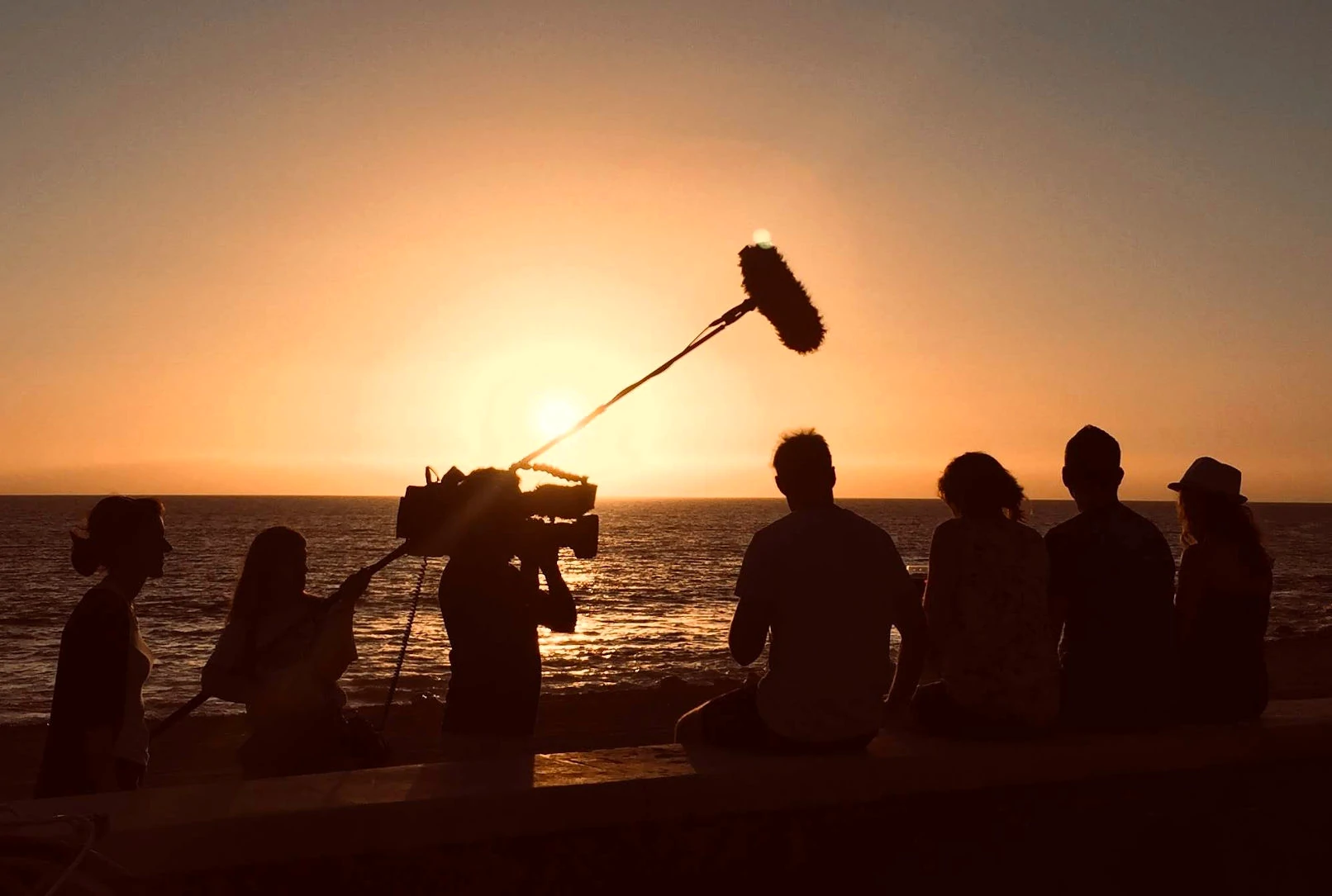 camera crew germany cameraman München video team black at white media film tv production beach sunset